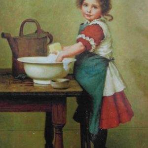 Meisje die kleding wast